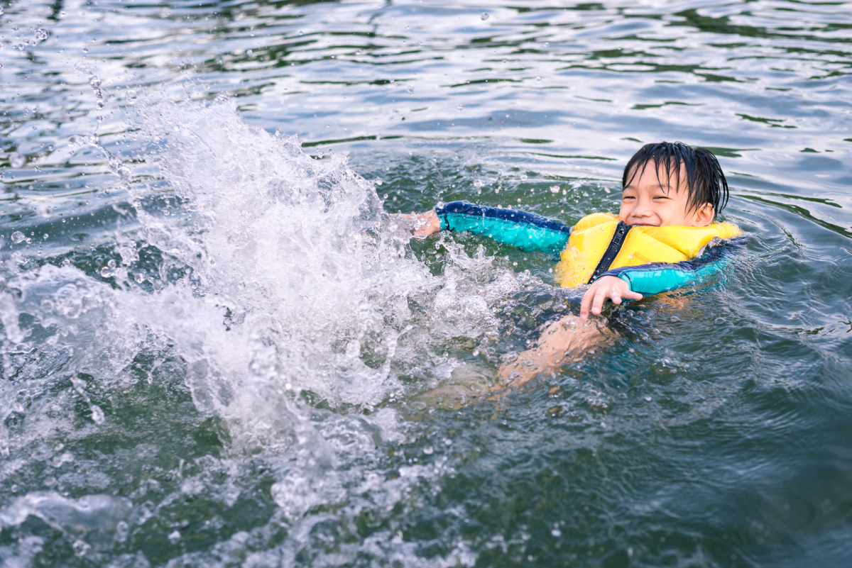 Little Boy Happy Swimming and Playing in the Lake – Sport and Re